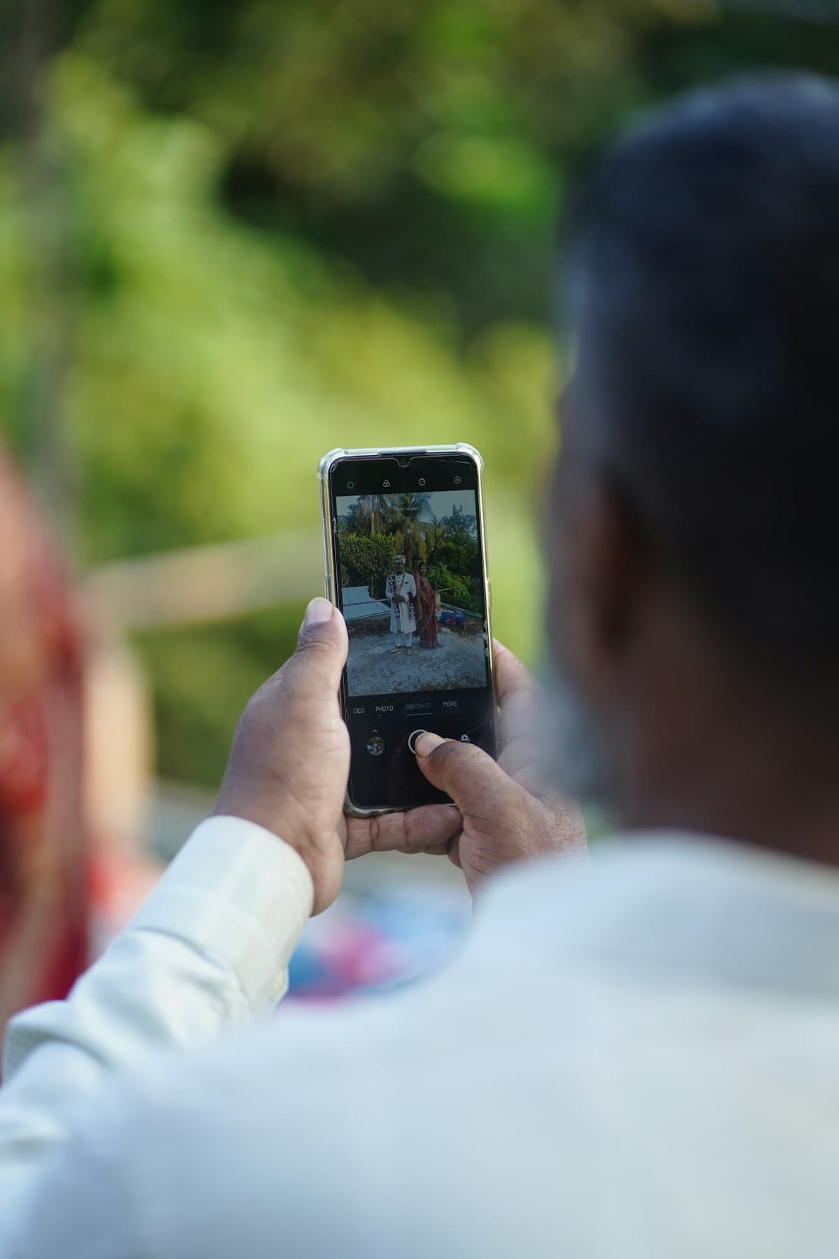 Indian wedding couple with smartphone — digital wedding invitation India guide