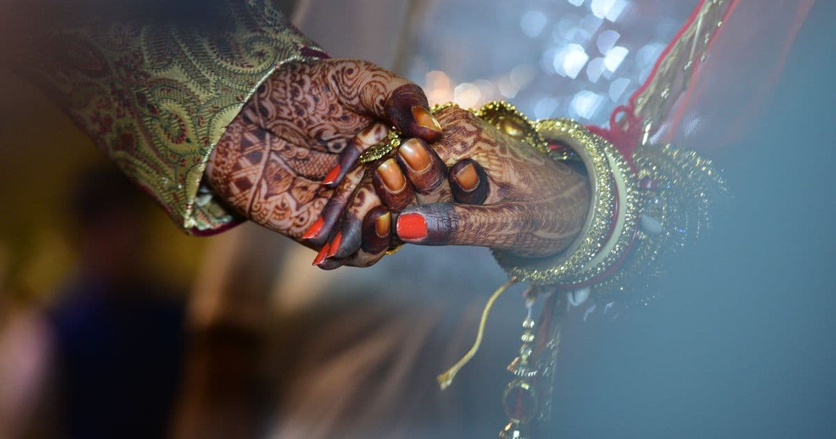 Indian wedding couple — WhatsApp wedding invitation India sharing guide